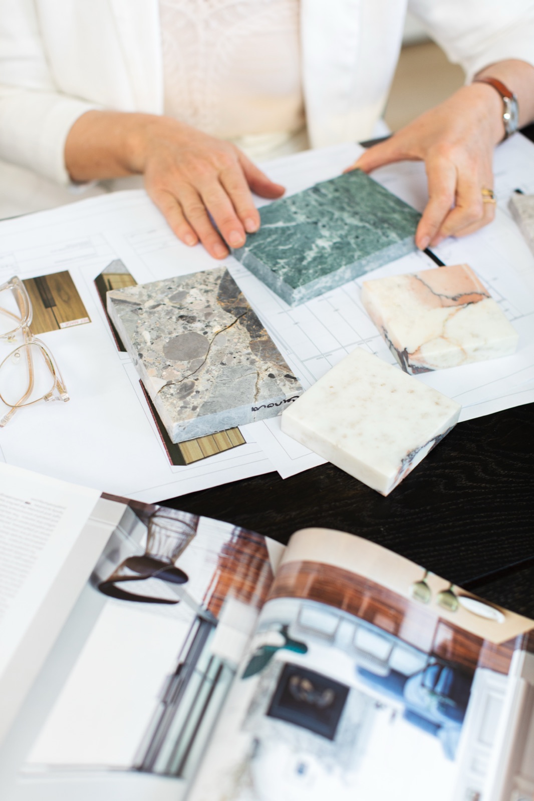 Stone and finish samples over floor plans