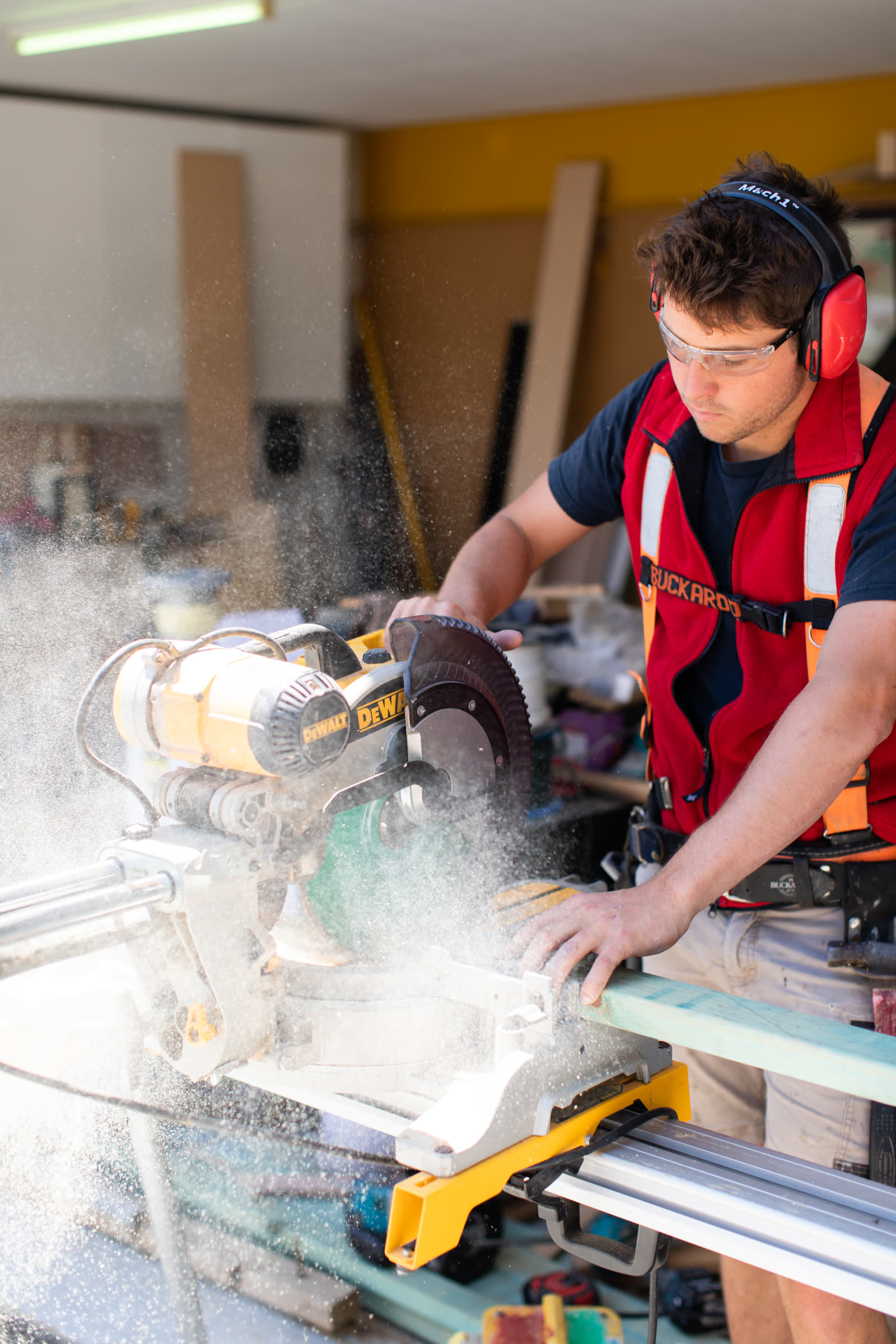 Hubert Auld on the table saw, mid-cut